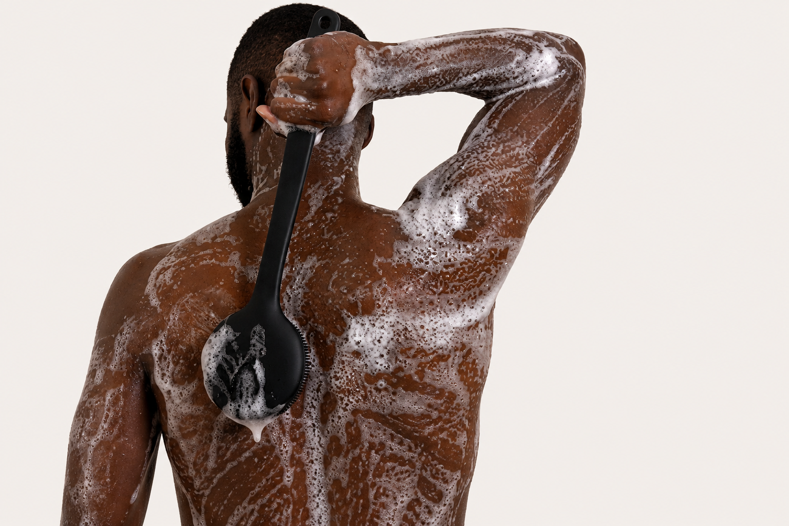 Long handle body scrubber in use